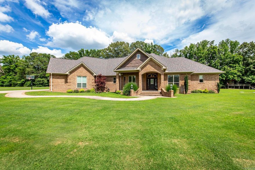 Beautiful custom built home located on 30 acres. Large open floor plan, custom built ins and paint. Soaring ceilings, granite countertops, wet bar, ice maker, lots of cabinets and storage with lower pull outs. Kitchen is a chef's dream, new cooktop, dishwasher has never been used, walk in pantry, island, custom spice racks, breakfast bar and dining area. Good size guest rooms on main floor share a Jack & Jill bath. Huge primary suite w/sitting area, walk in closet opens in laundry room. Certified safe room/gun storage. Primary bath has walk in shower, tub and every inch of storage possible. Christmas room has built ins for added convenience w/ storage/wrapping area. Formal dining area has lots of windows and can be used as an office. Patio has built in kitchen, grill & heated/cooled half bath.Upstairs you w/ find a massive bonus room/bedroom/walk in closet. Also on this property you w/ find an in law quarters/guest house with a kitchen, laundry room, bedroom and full bath that is handicapped accessible.  Large porch area for enjoying the deer playing in the field. Carport and storage building. Whole house generators on both homes and each home has its own septic. Agents see remarks