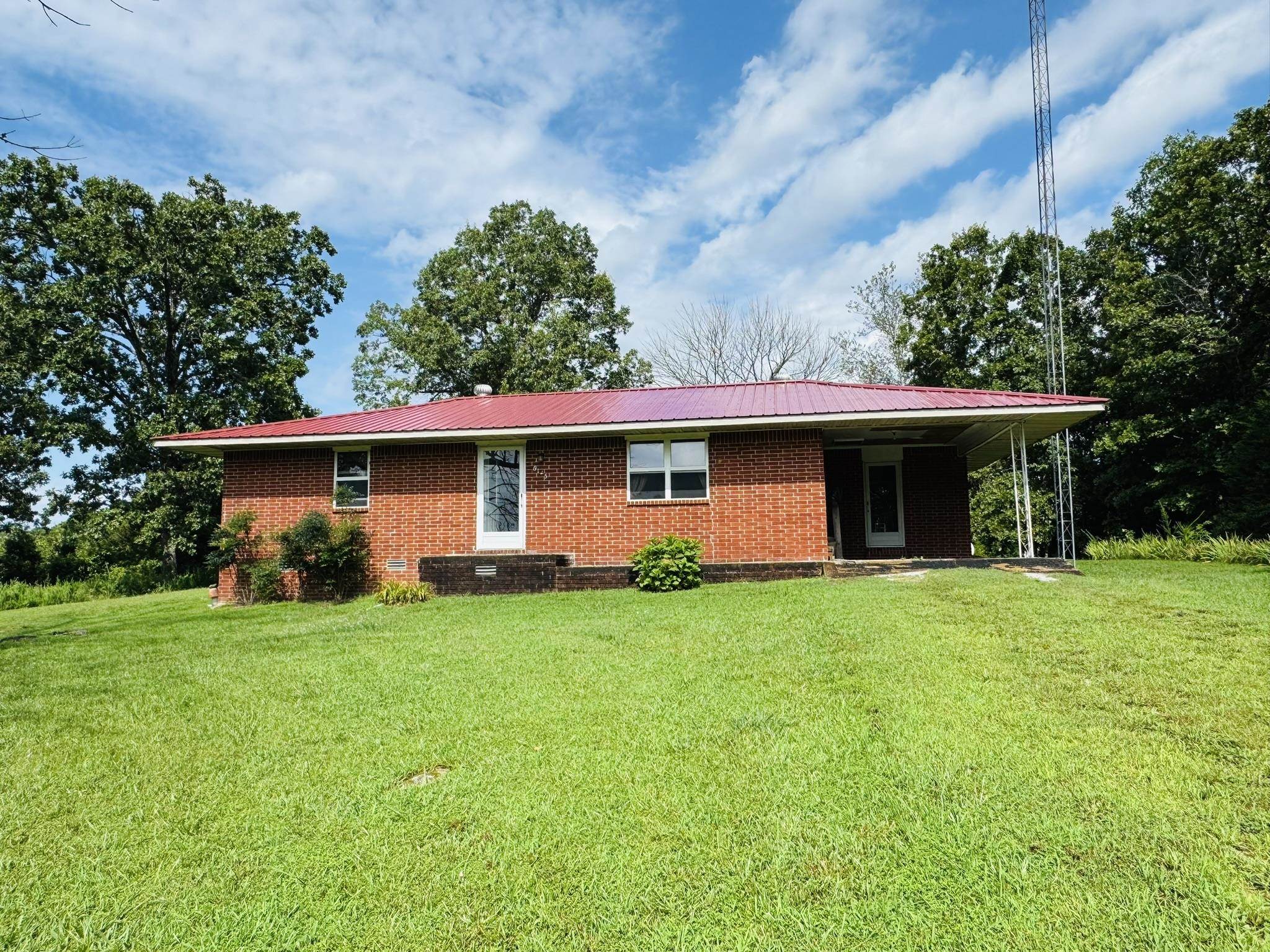 2 bed, 1 bath brick home on 2.5 acres outside of Salem, AR. This property offers an open floor plan layout with some updates throughout! The home has a new roof! Enjoy the convenience of a spacious 32x40 shop—perfect for hobbies, storage, or a small business. There is also an old home, that could be restored, or torn down to have a larger yard. Concrete slab near shop with electric, water, & septic hookup. The land provides plenty of room for gardening, pets, or future expansion. Endless possibilities at an affordable price!