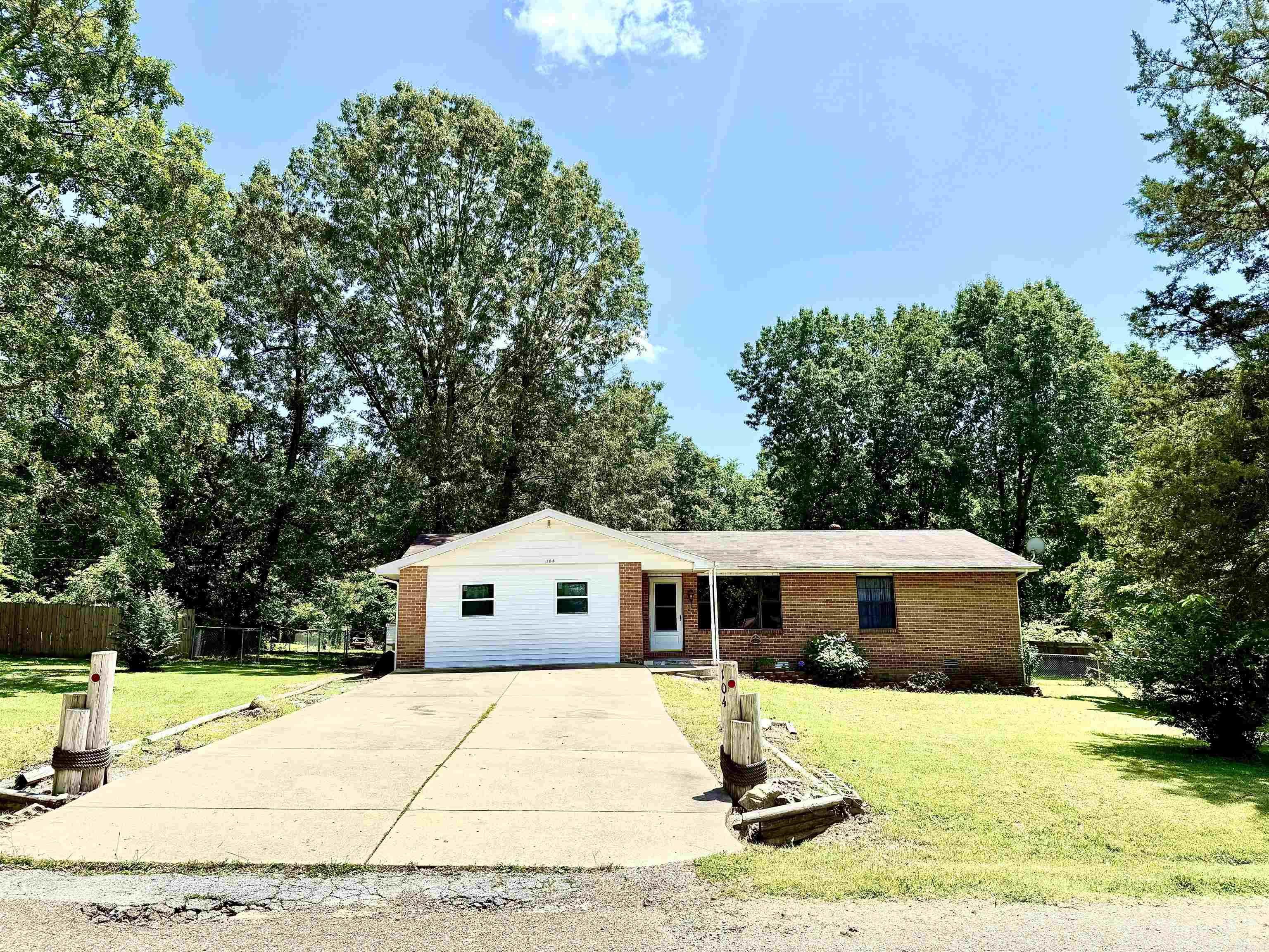 Welcome home to Castle Hill Drive! 2 bedrooms and 2 full bathrooms, and with a bonus sunroom/office that could be a third bedroom! Bring the kids and the dog, they'll love hanging out in the huge chain-link fenced backyard! It features a covered deck and an open deck for ultimate summer usage! Swing on the tire swing from one of the beautiful mature tress in the backyard. Kitchen has been updated with stainless appliances, including an awesome double/convection oven. Work has begun to convert garage into living space, you decide, it could easily go either way. One of the most unique features of this house is the main bathroom has a very large walk-in shower "room!" It's HUGE, and even has a window! The backyard backs up to the forrest, and gives the out of town feel, with all the convenience of living close. Come check it out, you don't want to wait on this one!