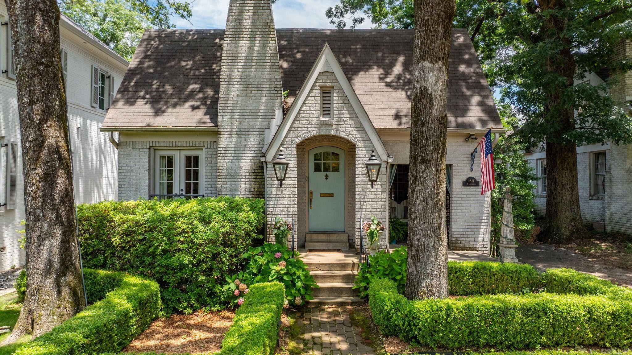 The most charming Heights Cottage with a wonderful addition & major renovation in 2014 by Creative Heights Builders. Formal spaces welcome you into the home. The formal living has hardwoods & a gas log fireplace. A darling covered patio on the front of the house enters into living room as well. The dining room has beautiful wallpaper & fantastic built ins. The remodeled kitchen has brick floors, Viking appliances, Carrara marble countertops & a nice sized pantry. Cute wine storage area with drink fridge. Breakfast table space. The family room off the back of the house has tall ceilings with wood beams, gorgeous, oversized wood windows & doors & a wood burning fireplace. The primary bedroom is on the main level. The bath has subway tile, marble countertops, a clawfoot tub, rainfall shower & a walk in closet. Also on main level: laundry room, an office (could be a 2nd walk in closet) & a powder bath. 2 identical bedrooms are upstairs off of a landing with storage. Both beds have own bath & Elfa closets. Backyard designed by Scott Lyon in the style of a New Orleans courtyard with a site built outdoor fireplace. Storage building plus a small one car garage, perfect for a golf cart.