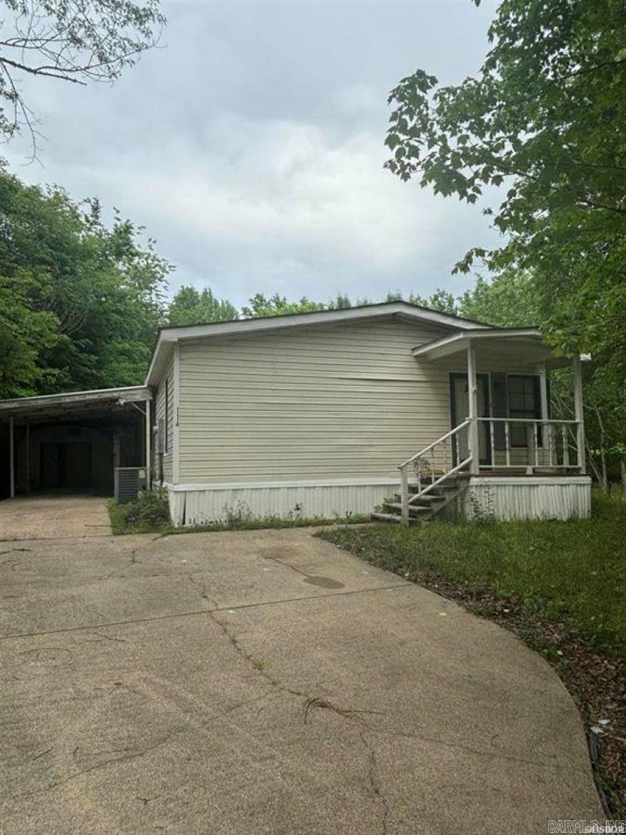 3 bedroom, 2 bathroom double-wide mobile home in Lake Hamilton School District! 1680 square feet. One-car carport. Corner lot. Ready for you to make your own home or a great addition to an investment portfolio! Roof less than a year old. Sold AS-IS.