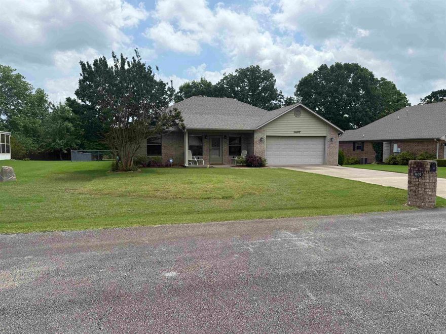Situated in a highly sought-after neighborhood in Heber Springs, this 3-bedroom, 2-bath residence is conveniently located near local amenities including the community center, Greers Ferry Lake, and the Little Red River - all less than 10 minutes away. The primary bedroom is remarkably spacious, boasting a large walk-in closet and an updated low step-in shower with a bench, and the additional bedrooms offer generous sizing, as well. The combined living and dining area is perfect for entertaining, while the expansive sunroom provides 240 additional sq feet of space. The home has a standard two-car garage. The backyard features a large deck ideal for grilling and a 15x18 foot garage/shop with electricity - ideal for storing outdoor equipment. The manicured yard features an irrigation system that maintains the health and beauty of the landscaping. Call today to view this one for yourself!