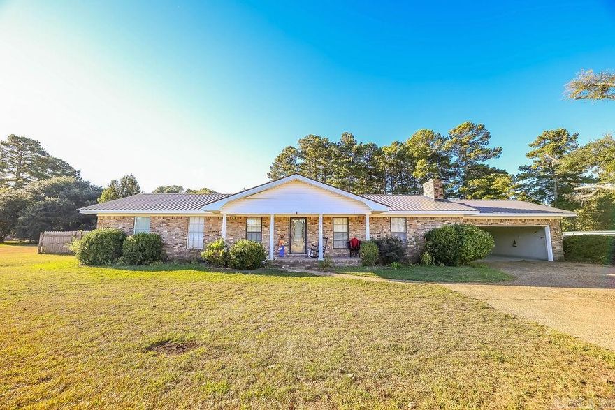 2951 Haynesville Hwy is a 3-bedroom, 2-bathroom house located in the Parkers Chapel school district. The home has 1,848 sq ft of living space and sits on a .93 acre lot. It includes a spacious den and a 2-car garage.    The backyard features a saltwater pool, a covered patio, and is fully fenced in. Ideal for outdoor activities or relaxation.