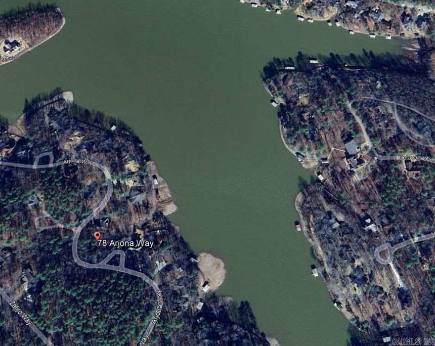 Beautiful Water Lake View Lot on Lake Cortez! Discover this 0.29-acre lot in the highly sought-after Hot Springs Village, with a path leading directly to the lake and a stunning million-dollar view.  Located in a gated community, this lot offers access to exceptional amenities, including 11 lakes, 9 golf courses, 16 scenic trails for hiking or biking, 2 beaches, tennis courts, pickleball, mini-golf, a fitness center, and so much more. Golf enthusiasts will love having 9 courses to choose from.