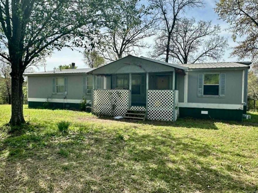 MOTIVATED SELLER! Spacious 3 bedroom/2bathroom double wide on 2.39 acres. You can lounge on the back deck in the large 6 person hot tub to see the beautiful mountain views! Partially wooded with great hunting opportunities for the abundance of wildlife . NO restrictions!  The home is currently getting an updated look with new LVP flooring and fresh paint. It has a newer metal roof that is approximately 5 years old, 2 living areas, a filtered well, parking for larger vehicles or trailers, peach trees, blackberry bushes and more! Approximately 25 minutes to Mena and 1 hour to Broken Bow, Oklahoma for all of their great amenities! Great location for an affordable price!