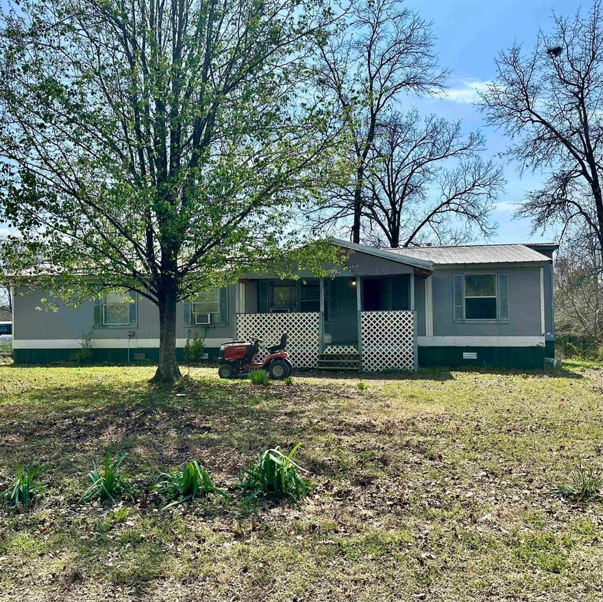 Spacious 3 bedroom/2bathroom double wide on 2.39 acres. You can lounge on the back deck in the large hot tub to see the beautiful mountain views! Partially wooded with abundance of wildlife to see. NO restrictions! The home is currently getting an updated look with new flooring and fresh paint. Approximately 25 minutes to Mena and 1 hour to Broken Bow, Oklahoma for all of their great amenities! Great location for an affordable price!