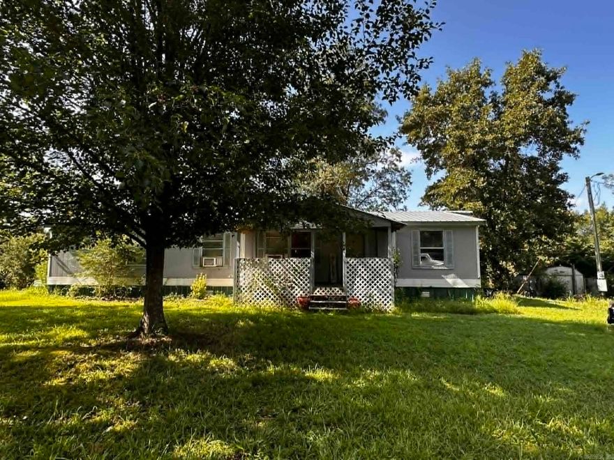 Spacious 3 bedroom/2bathroom double wide on 2.39 acres. You can lounge on the back deck in the large 6 person hot tub to see the beautiful mountain views! Partially wooded with great hunting opportunities for the abundance of wildlife . NO restrictions!  The home is currently getting an updated look with new LVP flooring and fresh paint. It has a newer metal roof that is approximately 5 years old, 2 living areas, a filtered well, parking for larger vehicles or trailers, peach trees, blackberry bushes and more! Approximately 25 minutes to Mena and 1 hour to Broken Bow, Oklahoma for all of their great amenities! Great location for an affordable price!