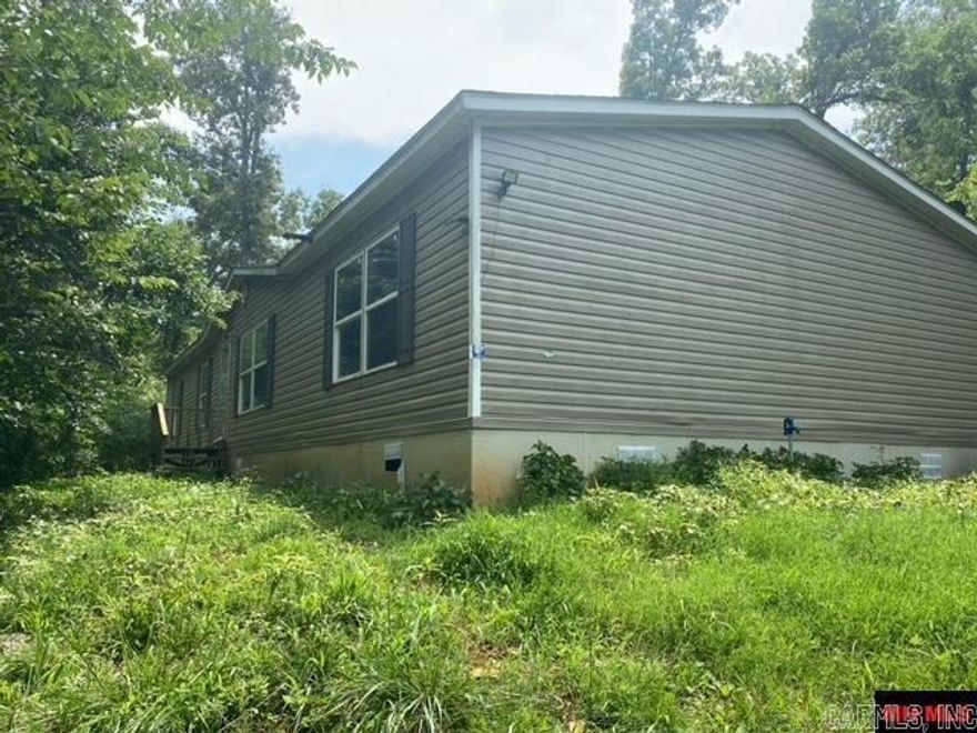 This 4 bed double wide is sitting just on the edge of town. Property offers plenty of privacy. Close to river access. Property is being sold as- is where is.