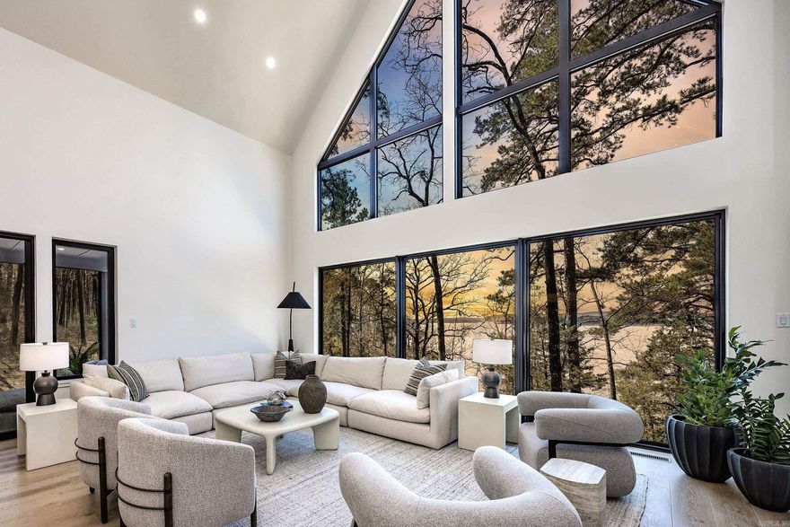 It really doesn’t get better than this—one of the best lakefront & lakeview properties in Tannenbaum & the entire Greers Ferry Lake area. Gentle sloping lake path to the shoreline makes it easy to moor your boat, zip up to the house for lunch, welcome guests or lounge on the shore watching jaw-dropping sunsets. Newly constructed in 2025, this home has it all—6 bedrooms (4 King ensuites, 2 lakeside w/expansive sliders & Juliette balconies) & 5.5 baths. Main level offers 2 ensuites, welcoming foyer, dining room & great room/kitchen w/wall of glass overlooking the water, plus ½ bath, hidden butler’s pantry/coffee bar/laundry, screened porch & lakeside deck. Just off the main level is a large game room for kids & adults. Upstairs #1 has 2 BRs, 1 BA & 2 lofts; Upstairs #2 has 2 ensuites & loft sitting area. Professionally decorated & furnished, it’s truly move-in ready with thoughtful finishes throughout & inviting spaces designed for gathering. Low-maintenance siding & roof, Andersen windows & tile decking add ease of ownership & long-term durability. Close to Tannenbaum amenities—tennis, pickleball, basketball, boat launch, airstrip & golf—all just a short walk or golf-cart ride away.