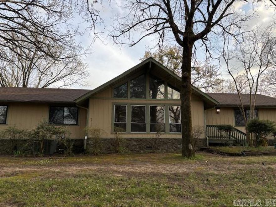 This 3/4 bed 2 bath home sits elegantly poised on a ridge encompassed by nearly 3 acres. With a little updating this  house will be a gem in the Treasure Hills neighborhood.   House has vaulted ceilings with lots of glass and a deck overlooking the beautiful back yard.  The carpet has been removed from bedrooms and living rooms, and is almost ready for new  carpet or LVP.  The outside decking needs to be replaced so be careful walking on it.  House has durable aluminum siding, roof is only a couple years old, and the septic lines were recently replaced.  The house comes with a whole house generator that comes on automatically when power goes off.  Priced to sell quickly, shedule your showing before it’s gone!
