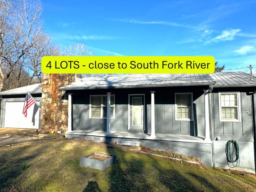 Walking distance to South Fork of the Spring River where there is public access area! 4 lots- great PRIVACY- Back yard is fenced! Part time creek sounds can be heard during rainy weather. 2 nice size bedrooms & spacious bath. Central heat and air plus lovely wood burning fireplace in dining room area. Living room-dining room open to kitchen. All kitchen appliances are included. Large basement (accessed from outside) offers loads of opportunities and laundry hook up. Attached 1-car GARAGE.  Gas tank is owned and goes with house (gas prorated). All this room- all this land- perfect place to make some magic!! Listing #2423