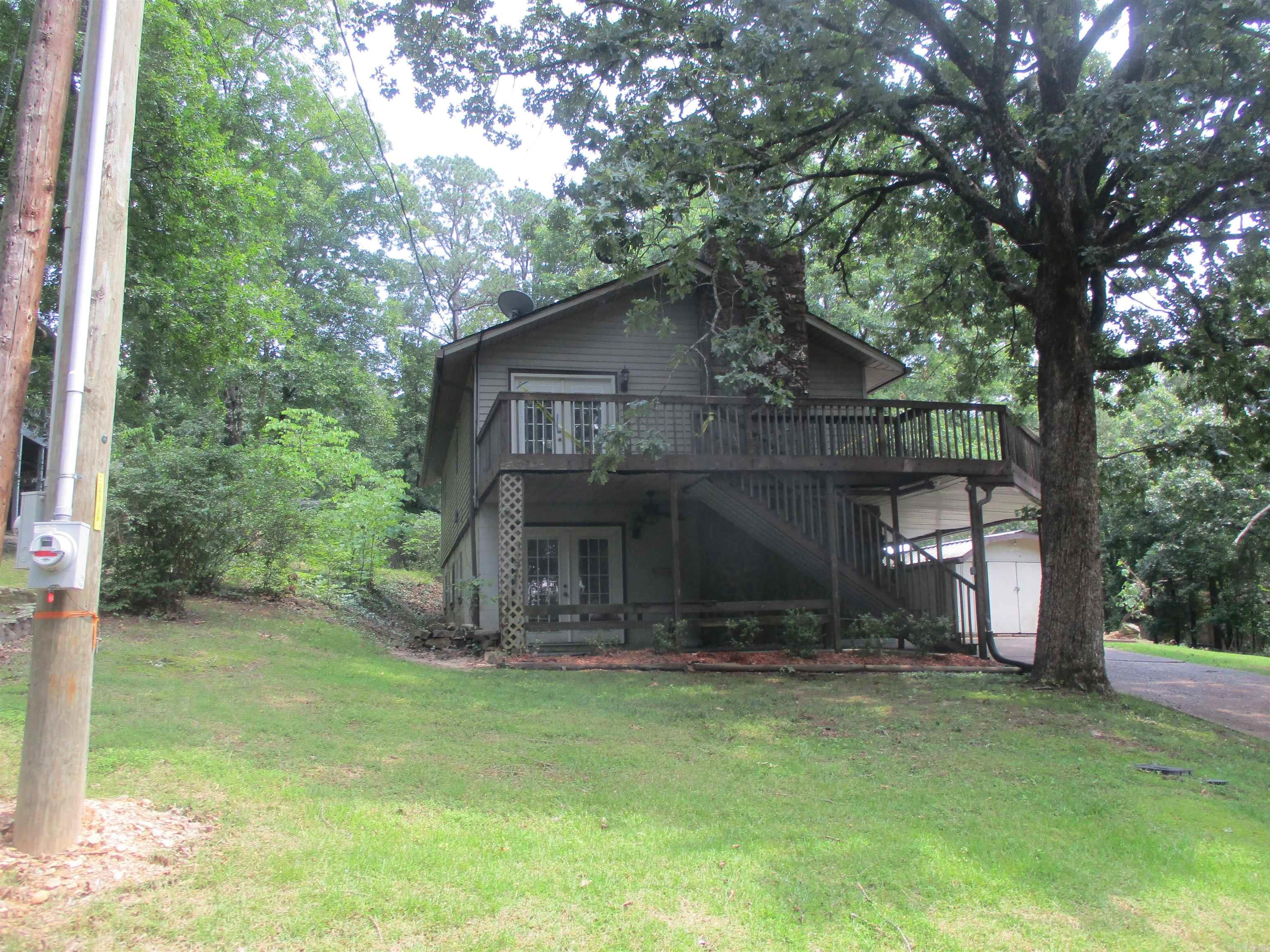 This cute 4 bedroom 3 bath home is located a few minutes from the Lake in the heart of Fairfield Bay. This home features two living areas, covered parking, and extra outside storage. Don't miss out on this great space buy!! This is a Fannie Mae Homepath property so agents, see agent remarks on where and how to submit offers.