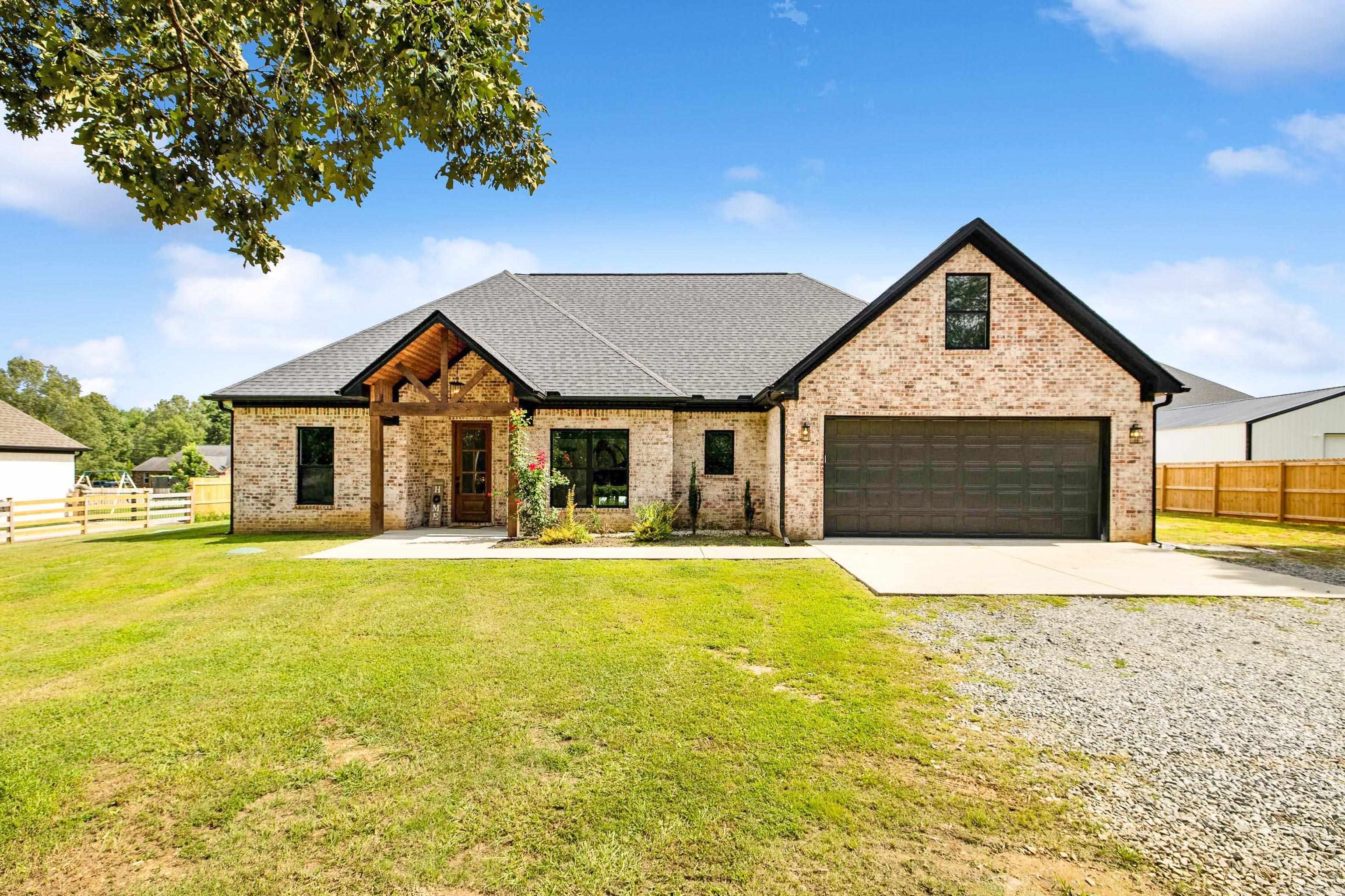 Modern meets country charm in this spacious 4-bedroom, 3-bath home on a half-acre lotāno HOA, no BOA, and room to breathe. Located in the sought-after Bryant School District, youāre just 15 minutes to I-30 and 20 minutes to West Little Rock, offering both peaceful living and quick access to town. Step inside to find an open layout with thoughtful details throughoutādedicated office space, large walk-in pantry, quartz countertops, and a natural gas stove perfect for home chefs. The indoor and outdoor fireplaces set the tone for cozy evenings, while the tankless water heater ensures energy efficiency. The primary suite features a soaking tub, glass shower, and a spacious walk-in closet for a true retreat experience. Nearly completed fencing, making the backyard ideal for entertaining or relaxing. This one checks all the boxesāspace, style, and convenience in a quiet country setting. Schedule your showing today!