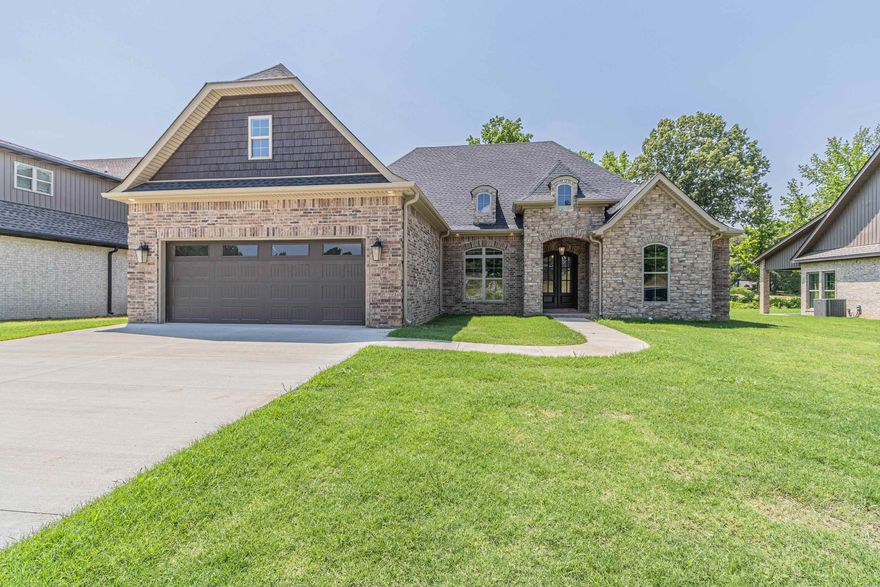 Elegant Luxury in Creekwood Addition  Step into timeless elegance with this stunning new custom home in the sought-after Creekwood Addition. Every detail has been thoughtfully designed, from the expansive open living space anchored by a dramatic towering stone fireplace, to the chef-inspired kitchen featuring top-of-the-line Bosch appliances, sleek quartz countertops, and polished gold fixtures that elevate the aesthetic.  Enjoy casual meals in the light-filled breakfast area or host special occasions in the formal dining room just off the main living space. The covered back patio offers seamless indoor-outdoor living, complete with a beautiful stone outdoor fireplace—perfect for relaxing or entertaining year-round.  The magnificent primary suite is a private sanctuary, offering a spa-like bath and a spacious walk-in closet. A separate guest suite features its own private bath, while two additional bedrooms share a well-appointed walk through bath. Upstairs, a generous bonus room provides the perfect space for a media room, playroom, or additional living area.  Energy efficiency meets luxury with spray foam insulation in the walls and T38 finish in the attic.