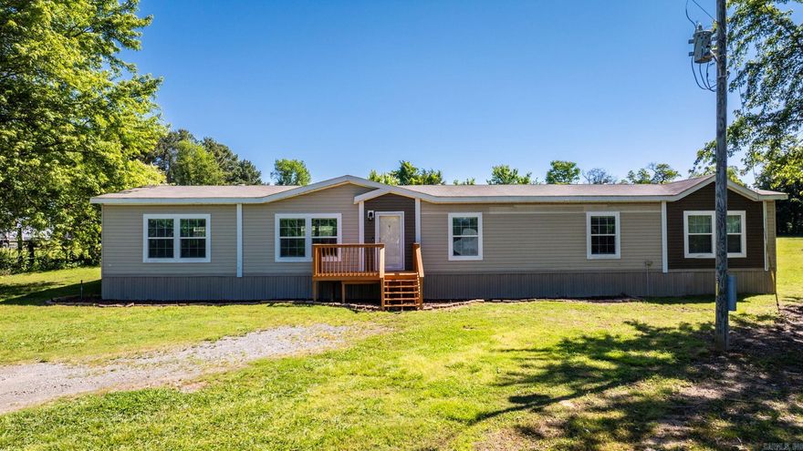 Have you been looking for acreage AND extra living space? This is the one for you! Be sure to watch the video walkthrough! https://listings.keyimageworks.com/videos/0196a580-82d7-71d5-8450-baa71d128fe6 This beautiful 4 bed, 2 bed 2015 double-wide mobile home is situated on 1.73 acres has plenty of space to play, for pets, or to build a shop! You will walk into an open-concept living space with a huge kitchen! Plenty of cabinets and countertop space. The bedrooms have a split floor plan with the primary bedroom being on one side of the house and the rest being on the opposite side. The laundry room is spacious with a workspace and a sink. The primary bedroom has a double vanity with a tub and stand-up shower along with a walk-in closet. The guest bathroom also has double vanities and a stand-up shower. Each room is spacious with closets. There is a bonus space at the end of the hallway that could easily be made into a large 5th bedroom or use it as a movie theatre/game room! This bonus space also has a sink and mini fridge included. The lot is level and cleared. Survey and property disclosure are on file. Seller will install a permanent foundation with a good offer.