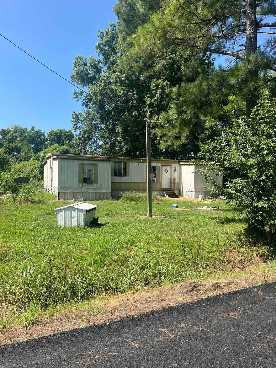 Investor special located at 107 E England Avenue in Marmaduke. This 3-bedroom, 2-bath manufactured home offers 1,104 square feet of living space and sits on a 0.21-acre lot inside city limits. The property is currently rented for $500 per month; however, there is no formal lease agreement in place, and the tenant is expected to vacate by August 15th. The home will need repairs and updates but has strong potential for increased rental income with improvements. Whether you’re looking to start or expand your investment portfolio, this is a great opportunity at an affordable price. Priced to sell at only $15,000, this property is being sold as-is. Please see agent remarks.