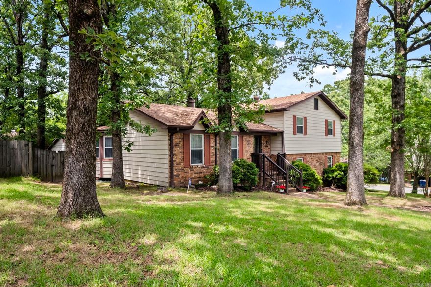 Welcome home to 6300 Rolling Hills Drive! This delightful, split-level home boasts many appealing features making it the perfect place to call home. Step into the inviting living room, which seamlessly connects to the dining area, creating an open and welcoming atmosphere. The dining area is perfect for family meals or entertaining guests, and is both functional and charming. The updated kitchen is a chef's dream with new quartz countertops, providing ample space for meal preparation. Start your mornings right on the covered deck, the perfect spot to enjoy your coffee and take in the peaceful surroundings.  New flooring, fresh paint, and a new roof were all completed in 2023!  In addition to the main home, there's a separate large shop/studio/garage in the back with its own driveway, perfect for hobbies, additional storage, or as a workspace. Situated on a spacious corner lot, this property offers plenty of outdoor space for activities, gardening, or simply enjoying the outdoors. This home is conveniently located near shopping and dining options, making it easy to enjoy all the local area has to offer. Don't miss out on this gem! Schedule your tour today!