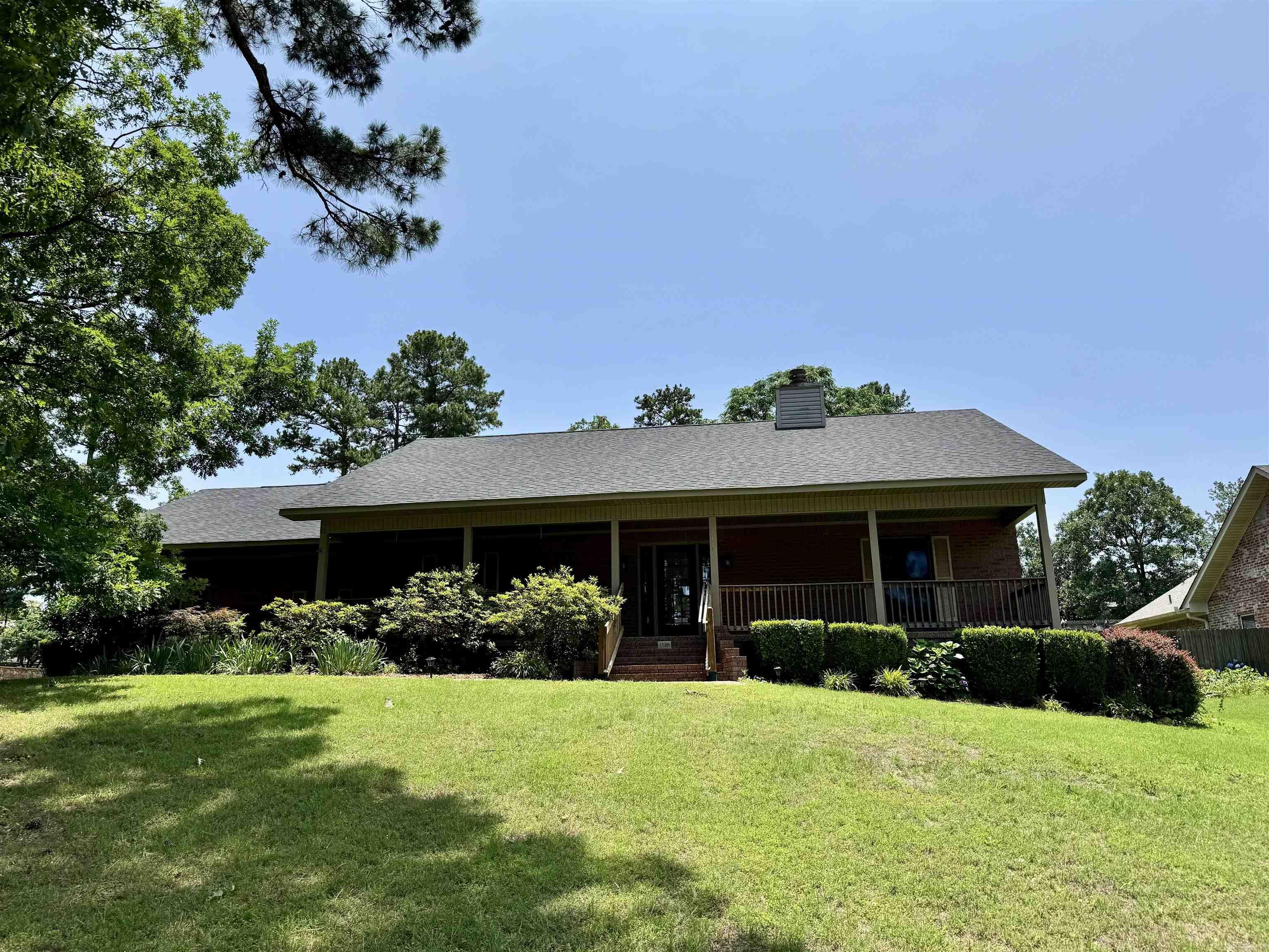 This pristine home overlooking Lake Hamilton has deeded lake access. Very well maintained and loved and is move in ready. The living area features a large brick fireplace with vaulted hardwood ceilings. Formal dining with breakfast nook in the kitchen. Beautiful hardwood cabinets with lots of cabinet space. Oversized laundry room with office area. Large primary bedroom with tray ceiling. Primary bath with separate walk in shower and tub. Dual large closets. The guest rooms are on the opposite side of the home. Enclosed back porch makes a great space for entertaining. Shop in back is great for storage or possible mancave. Two car garage with additional covered parking. Newer kitchen appliances, roof and HVAC replaced in 2023. Whole house generator installed in 2024.
