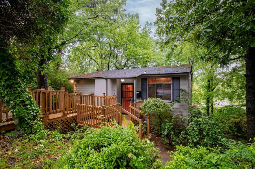 This is the perfect location for an easy walk to all the amenities of Hillcrest including boutiques, coffee shops and restaurants along Kavanaugh Blvd. This home features an main level primary studio and a lower level guest suite with exterior access. Large windows provide abundant natural light and tree house views. The utility / laundry room also has exterior access and a walkway to an outdoor patio. The backyard is fully fenced. Agents see remarks.