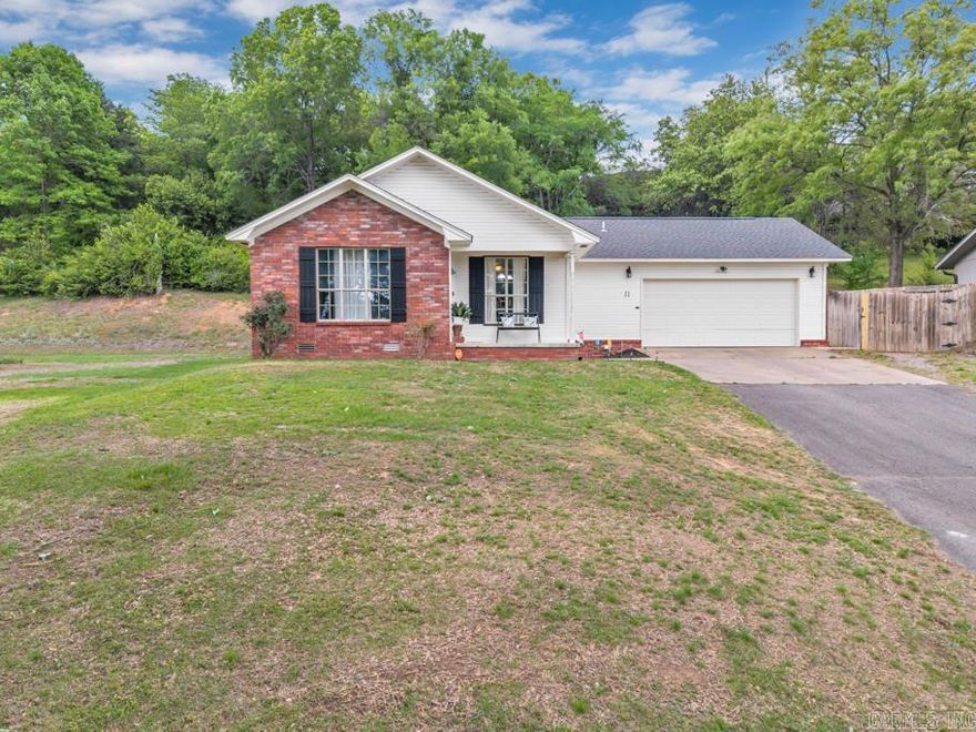 Super cute 3/2 in a desired location in Morrilton! This home has fresh interior paint throughout! Large living room with beautiful wood floors! All kitchen appliances convey.  Microwave is only 1 year old. Separate laundry room. Primary bedroom has it's own full bath and a walk-in closet. Fenced backyard!