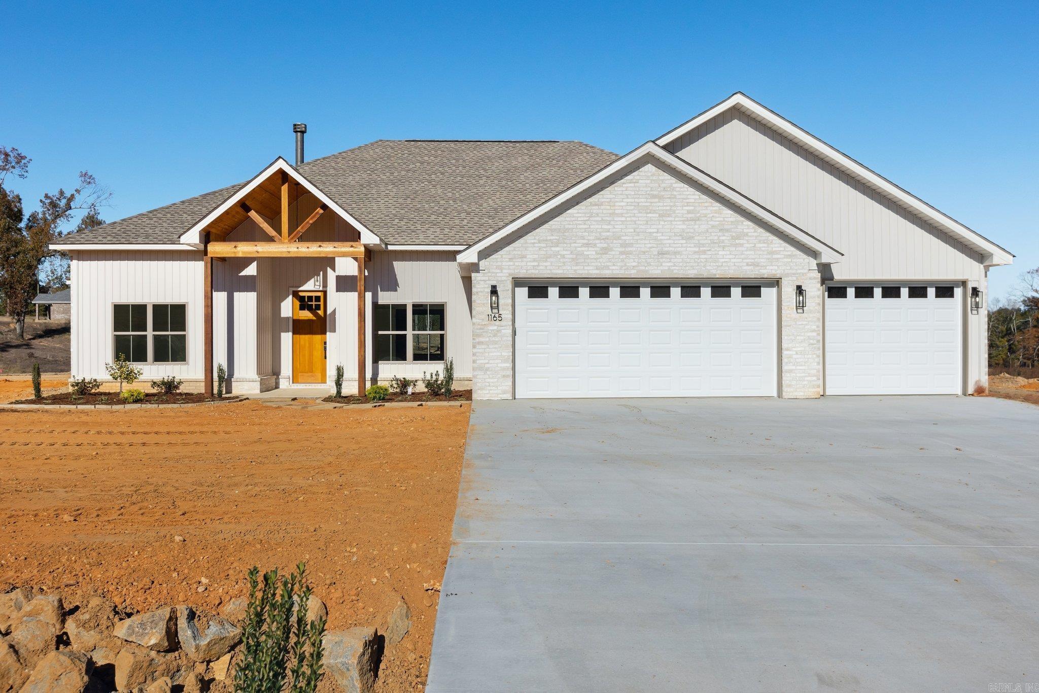 Discover this stunning 4-bedroom, 2-bathroom new construction home nestled on a spacious 1.39 acre lot. Boasting 11-foot ceilings, this home features a dedicated office, flex room that you could use as a game room, den, 2nd office or 4th bedroom. Other features include a cozy wood-burning fireplace and walk-in pantry with butcher block countertops. The kitchen is a chef's dream!! Equipped with two ovens perfect for entertaining, ample cabinetry for all of your storage needs and plenty of counter space. The luxurious primary suite offers a spa-like retreat with a walk-in tile shower and expansive his-and-hers walk-in closets complete with built-ins. Come enjoy the perfect blend of style, comfort, and country living in this exceptional home! BUILDER IS OFFERING $5000 IN CONCESSIONS WITH AN ACCEPTABLE OFFER!!