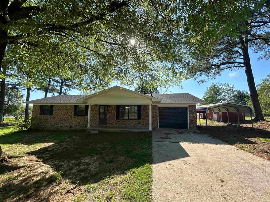 Welcome to your dream starter home, tailored perfectly for your growing family's needs. To ease your mind and to provide protection from the elements for the coming years, the roof was replaced in 2023! As you step onto the property, you're greeted by not just one, but two outbuildings providing storage needs, etc. There is also a carport, fenced in area for your animals, one car garage, and a storm cellar. The inside offers a charming, kitchen, an adorable gas fireplace, a renovated master bathroom among other updates, and lots of storage space throughout.  With its welcoming atmosphere and great location, this home invites you to create cherished memories and embark on the journey of homeownership with confidence and excitement. Call for your tour today!  Age of HVAC - Unknown. Hot water heater- 5 years or less. Living room fan/light has been bought for the new buyers to replace.