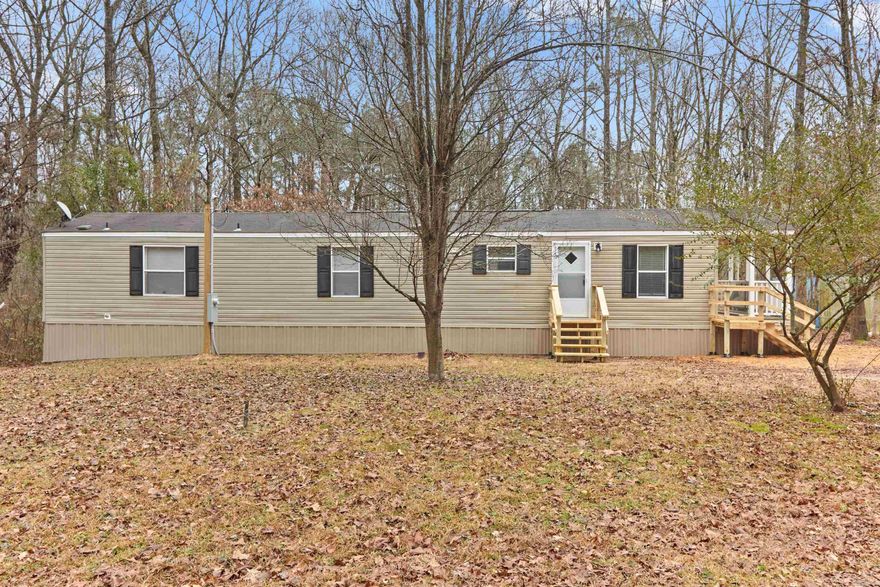 Newly remodeled 2 bedroom 2 bath country home. New paint, new flooring, New front and back large decks. Ready for you to move right in. Whether you're seeking a cozy starter home, downsizing, or looking for a weekend getaway, this remodeled mobile home offers the perfect retreat.