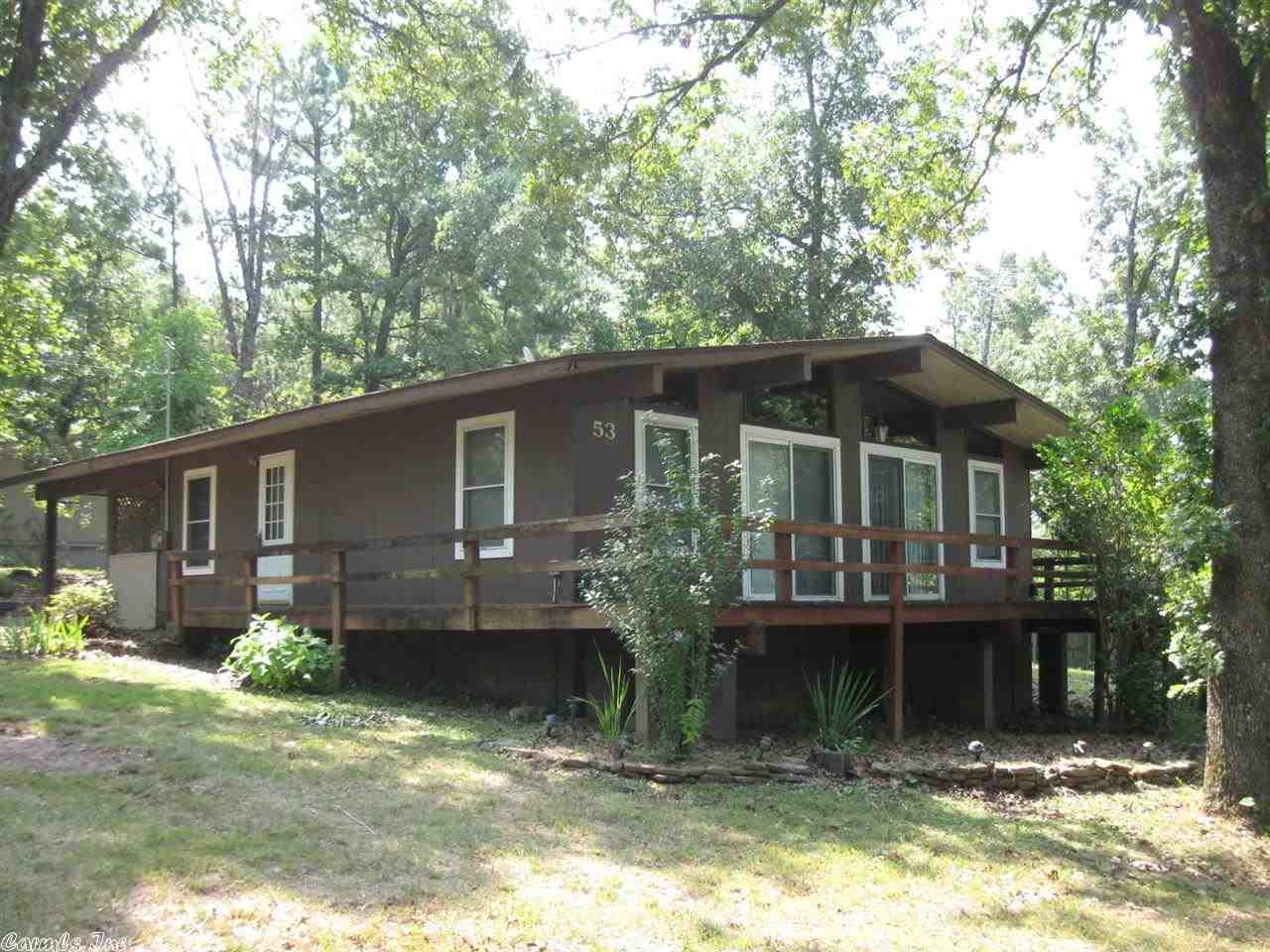 WOW LOOK AT THIS GREAT NEW PRICE!! This updated and well maintained home has open floor plan, large living room with fireplace & insert plus newer sliding doors for lake view, newer carpet & paint, newer black range, microwave & dishwasher & lots of cabinets in kitchen, third bedroom/bath in laundry room, nice three-season room, great wrap around deck & newer storage bldg.