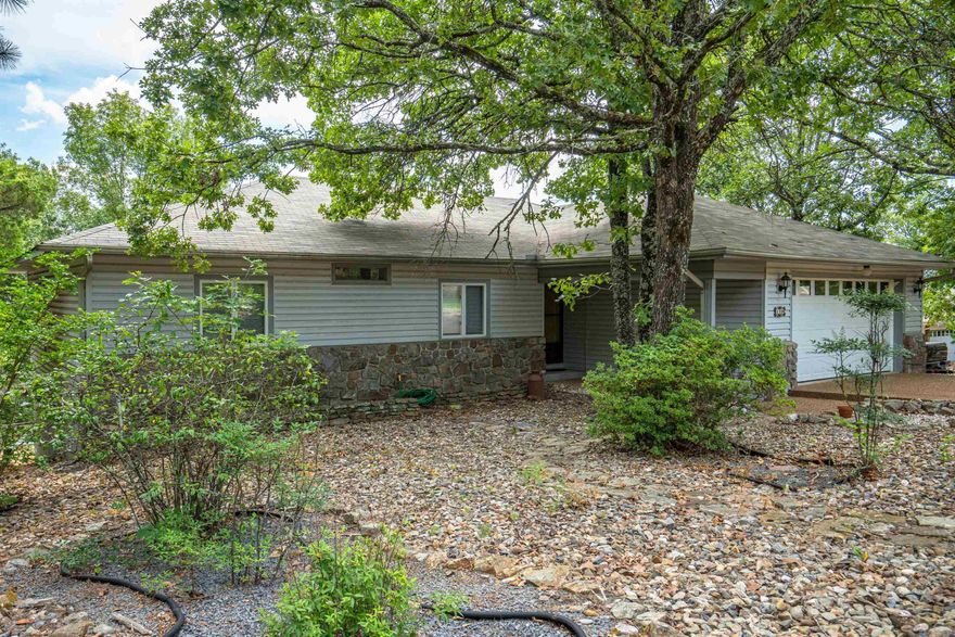 Winter mountain view possible from the Arkansas room of this GEM! Three bedrooms and 2 bathrooms on the main level and a blank palette on the lower level of approximately 800 sq ft not included in the total living square footage!! It could be finished out as a guest suite, craft area, media room, or could be used as storage or workshop just as it is! Level back yard could be fenced or garden boxes could be utilized! Two car garage and a level driveway makes this one a contender! Just minutes to golf courses, lakes, restaurants, medical, and West side shopping! Easy access to the West gate. Lake DeSoto marina, pool, and pickle ball courts only minutes away!