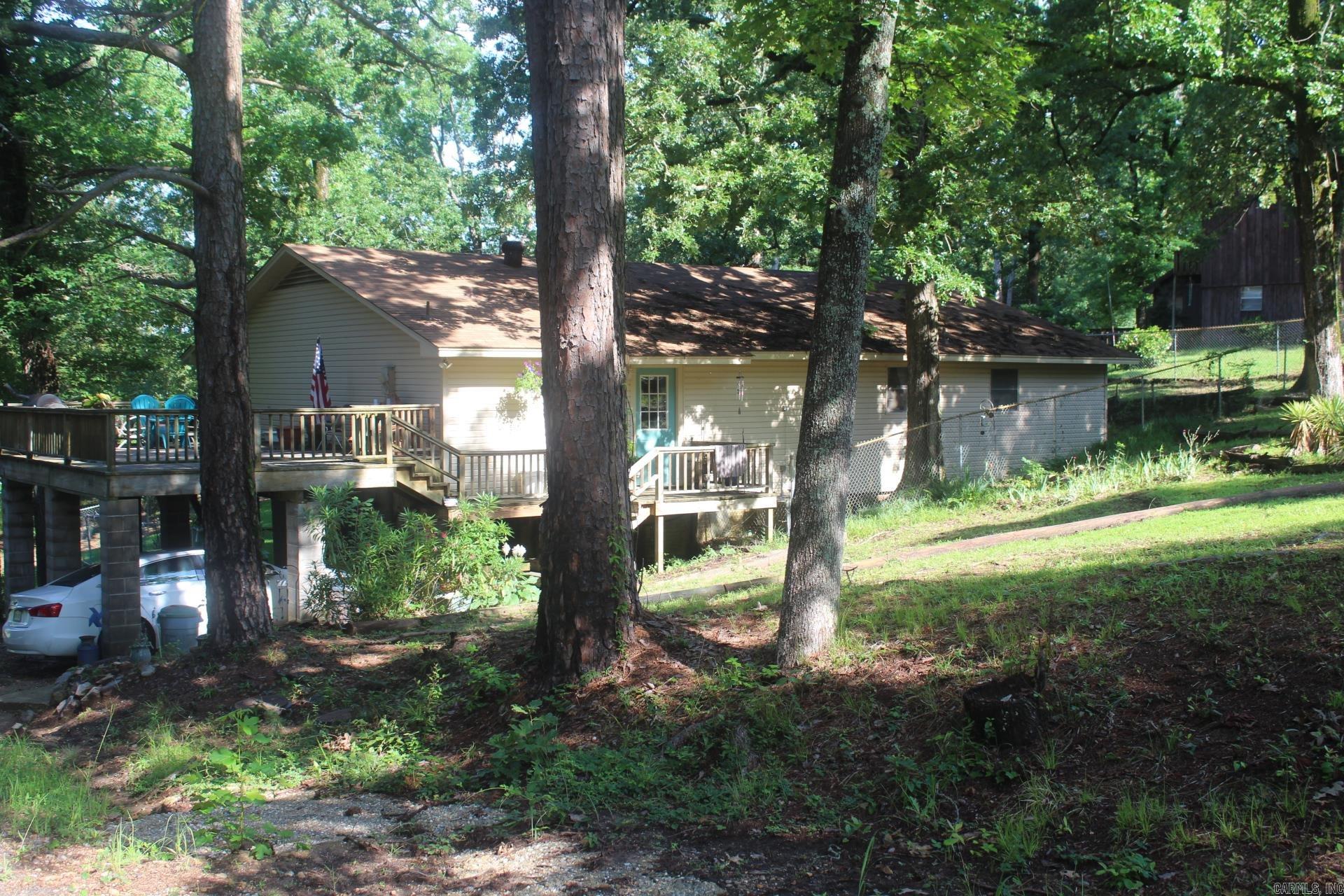2 Bedroom, 1 &1/2 Baths with approx. 1980 Sq. Ft. of living space. Two Living areas, main living area features beamed ceiling. Central AC & Heat. Roof only 2 years old. Range, Microwave and Refrigerator convey with sell of property.