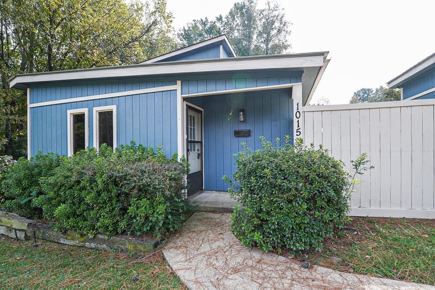 NEW LOWER PRICE!  BETTER HURRY! Come see this wonderful home with angled wood plank walls surrounding a fireplace with new gas logs, high ceilings and lots of light. This unique home provides fresh paint, beautiful Luxury Vinyl Plank and ceramic tile flooring, a brand new range, and a new outside a/c unit. 3 bedrooms, 2 baths, central heat/air, 2 car carport.   Located in a convenient area, close to schools, shopping and downtown.  A very large fenced backyard with a storage building and a concrete patio perfect for BBQing or kids toys. This home only needs YOU!  Don't wait, CALL TODAY!