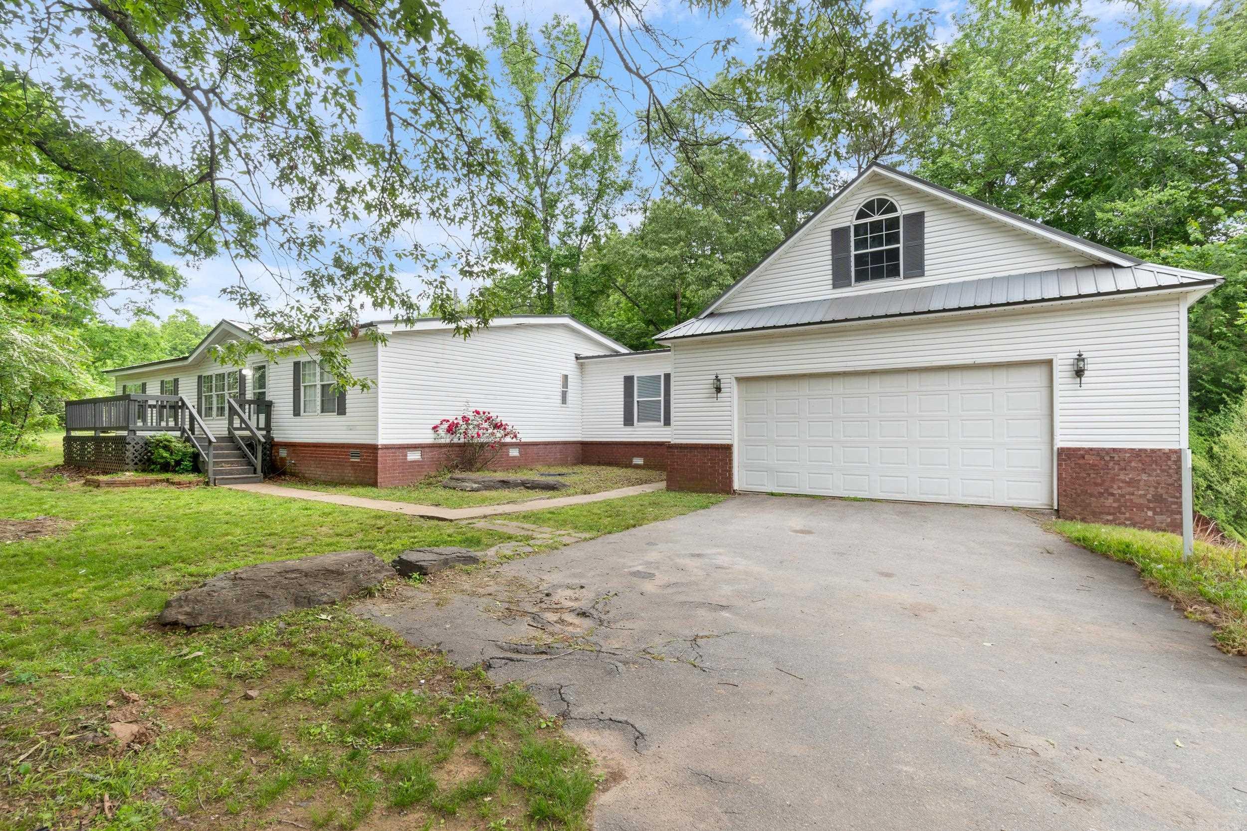 Stunning Remodeled Mobile Home on 16 Acres in White County! Welcome to 1121 Highway 31—a beautifully updated 4-bedroom, 2-bath mobile home nestled on 16 mostly wooded acres. This serene retreat blends modern comfort with natural beauty, offering spacious living areas, stylish finishes, and an open-concept layout perfect for entertaining or relaxing. Each bedroom provides generous space, and the renovated bathrooms add a touch of luxury. The attached 2 car garage features a nice heated and cooled bonus room. Plus there is a 28x28 shop. Enjoy abundant wildlife, including deer, right outside your door. Just under a mile from Lake Barnett, you’ll have easy access to fishing, boating, and outdoor adventure. Whether you’re seeking a full-time residence, vacation spot, or peaceful getaway, this property offers the best of country living with modern amenities. Schedule your private tour today!