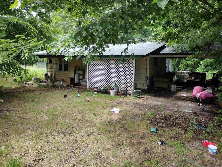 This Home needs some work and also a new septic system has shop that could be used for lots of things with Hwy frontage