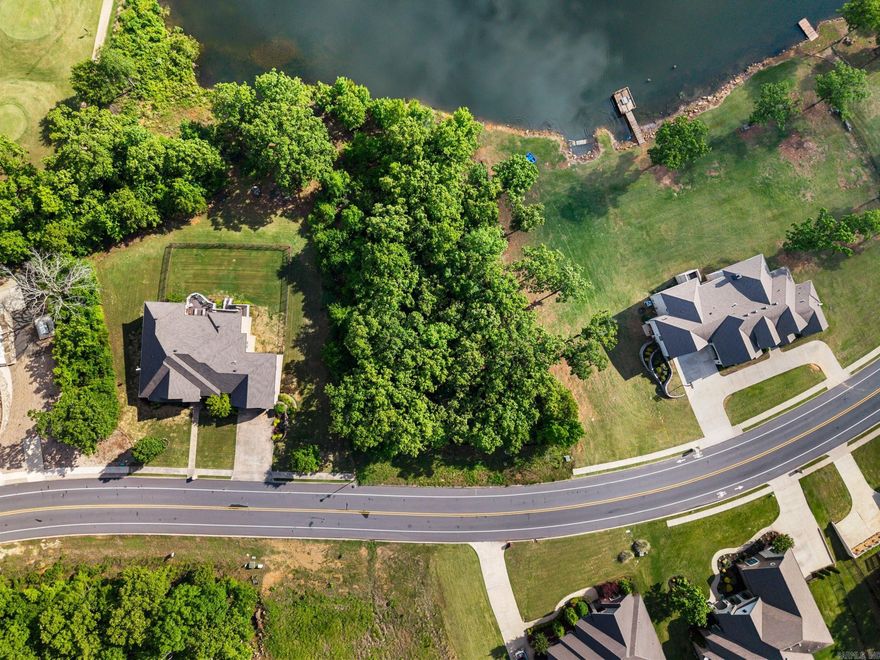 Rare opportunity in a highly sought-after golf course community!  This premier lakefront lot is the last available homesite eligible for a private dock-making it truly one-of-a-kind.  Build your dream home and enjoy direct water access, scenic views, and all the amenities this desirable neighborhood has to offer.  Opportunities like this don't come around twice-secure it before it's gone.  Existing survey.