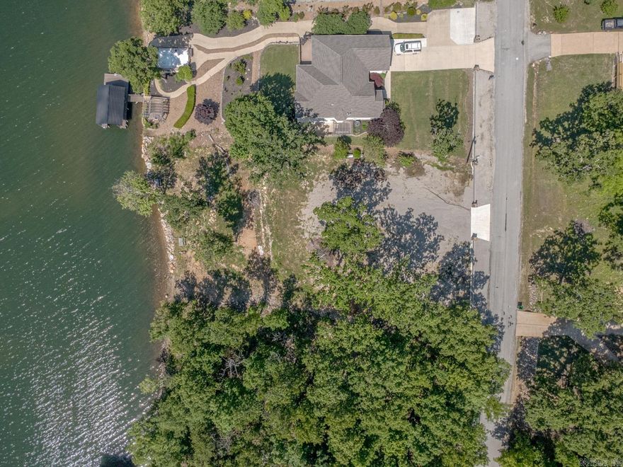 Welcome to Market 1503 Emerald Cove in Horseshoe Bend, AR. Situated on a 0.50 +/- acre waterfront lot in the Emerald Cove Addition offering 111 +/- ft of shoreline frontage on 640 +/- acre Crown Lake is an opportunity to secure your own piece of lake life. Sprinkled w/ mature shade trees and already cleared for your future build, the groundwork has been laid for your custom home, or investment property. Seller improvements include professional land clearing designed to maximize views and natural beauty, rock shoreline reinforcement for a natural waterfront appearance, compacted and settled site preparation for a future home and patio/garage area, plus a concrete and steel approach and decorative estate-style frontage wall w/ water and electric available to the property. Enjoy direct access to boating, fishing, skiing, kayaking, and your favorite water activities right from your own backyard. Located within a subdivision featuring marina access, golf course, clubhouse, playground, fitness/bike trail, and nearby airport access. You'll love all the amenities that Horseshoe Bend has to offer. Call today to schedule your tour and make an investment in tomorrow.