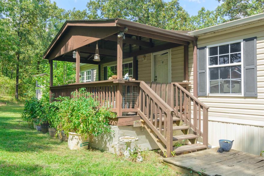 UPDATE:  PRICE REDUCTION and SELLERS WILL Pay UP TO $4000 toward CLOSING COSTS!!  From the country covered front porch, be prepared as you step into the definition of open floor plan.  Standing in the massive living room you gaze to your left through the archway at the gourmet kitchen with a 4' x 8' island.  The living room and kitchen open to what could be used as a huge dining room with a stone, wood burning fireplace.  Amongst this openness is also an archway exposing the office area!  Three large bedrooms and a full bath at one end of the home with a private master suite at the other.  A five piece master bath including a stone inlay soaking tub as a centerpiece.  His and her walk-in closets.  Enjoy the family from the 8' x 30' deck overlooking the backyard.  5 acres of hunting from your tree stand, weeding your garden area or tending the animals in the chicken coop or fenced areas for other livestock. This is a private paradise at a dead end road just outside city limits and minutes from town.  New roof, gutters, newer HVAC ducting and water heater.