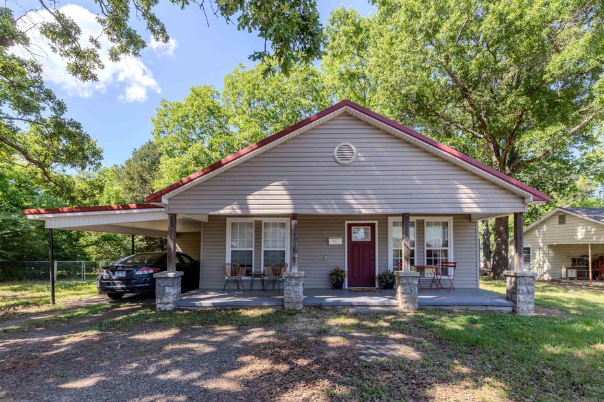 Beautifully renovated from top to bottom, this move-in ready home blends modern updates with timeless small-town charm! Relax on the welcoming 8’x28’ front porch or enjoy the spacious, fully fenced backyard complete with a large storage building for added convenience. Inside, the open-concept layout features a bright living, dining, and kitchen area highlighted by brand-new granite countertops, stainless steel appliances, updated lighting, and crown molding. Also, the refrigerator will convey! Major upgrades include all-new spray foam insulation, sheetrock, flooring, electrical, plumbing, ductwork, and fresh paint throughout. The home also offers spacious bedrooms, a walk-in closet, and a beautifully updated hall bath with a walk-in shower and granite vanity. A dedicated laundry room with built-in cabinetry and washer/dryer hookups adds everyday functionality. With low-maintenance siding, a metal roof, and newer windows, this home is designed for easy living and lasting value. Conveniently located near hospitals, shopping, and interstate access — this one is truly turnkey and ready to welcome you home!