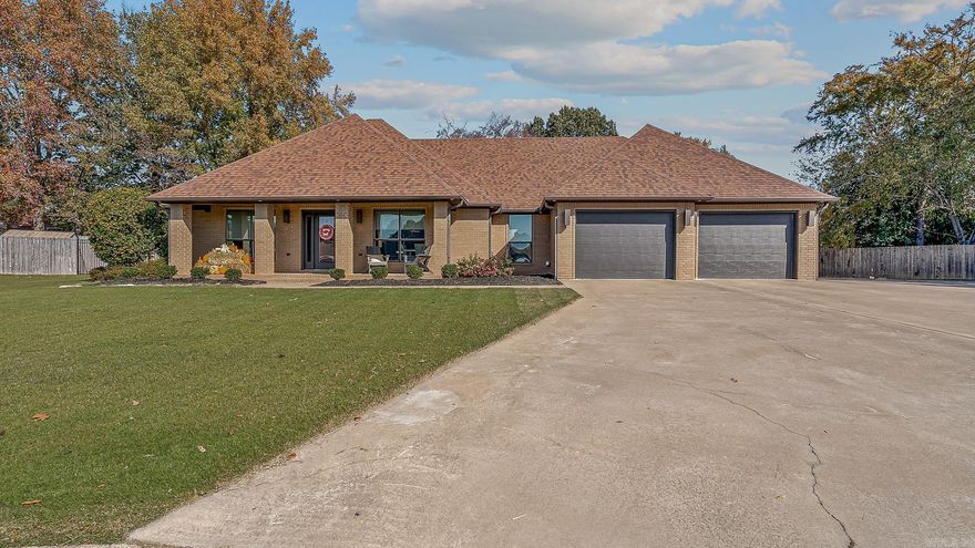 Step into modern comfort and timeless craftsmanship with this beautifully designed home. From the solid wood doors to the custom built-in cabinetry throughout, every detail reflects quality and style. The spacious living room features a sleek gas-log fireplace and flows seamlessly into a kitchen showcasing rich dark maple cabinetry and a built-in buffet — perfect for entertaining. The primary suite includes a versatile adjoining space ideal for an office or nursery, complete with a private exterior glass door for added convenience. Enjoy outdoor living year-round on the covered back patio, featuring a cozy brick firepit that sets the stage for relaxing evenings. A detached double garage/shop provides ample room for vehicles, hobbies, or storage. Every inch of this home has been thoughtfully designed for modern living with warmth, character, and attention to detail.