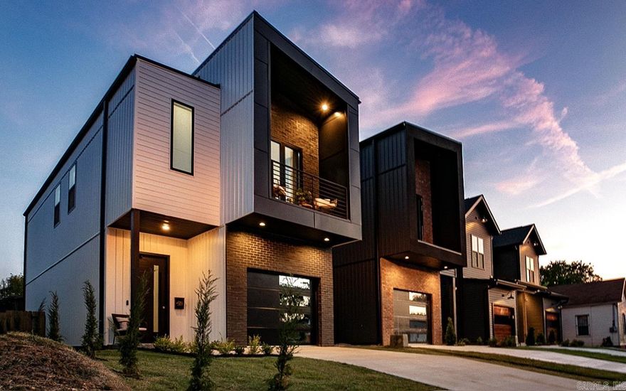 Nestled within the highly coveted SoMa/Pettaway neighborhood, this stunning home offers more than just a place to live. Crafted to captivate the tastes of those who value both substance and style, this home offers a custom architectural design that effortlessly blends elegance with functionality. With 10-foot ceilings gracing both levels, the home creates an airy atmosphere. As you explore, the spacious primary bedroom becomes your personal retreat, a haven of relaxation. Its spa-like bath and private balcony, adorned with skyline views, provide a glimpse into the cosmopolitan energy just beyond your door. This is a home that understands the allure of city living yet maintaining a sense of seclusion. Privacy is evident in the inclusion of a fenced yard and 1 car garage. Roller shades on all windows invite gentle sunlight to fill the spaces, while blackout curtains ensure peaceful nights. An entertainer at heart? The seamless flow between indoor and outdoor spaces sets the stage for sophisticated gatherings. Host friends against the backdrop of impeccable design. This is more than just a home; it's an expression of your tastes, a canvas for the lifestyle you've always dreamed of.