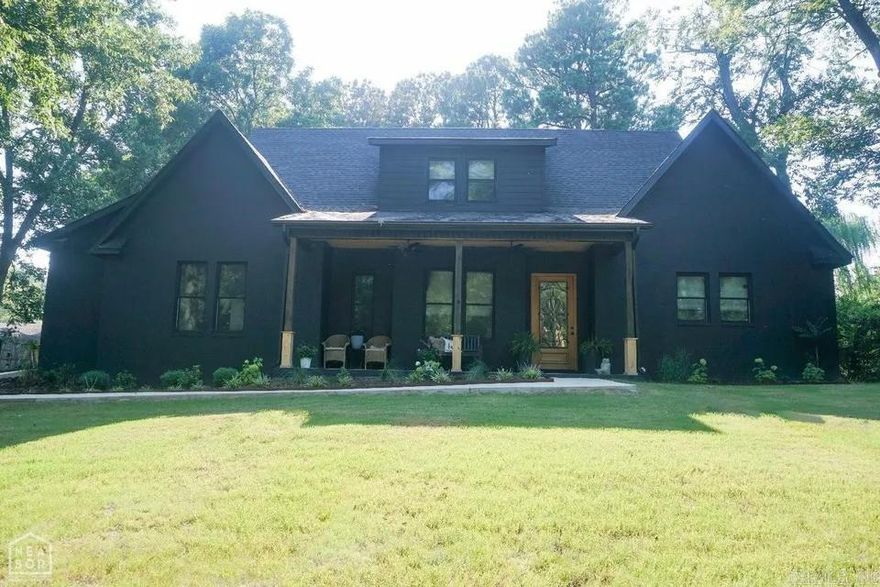 Tucked away on nearly an acre in the heart of Jonesboro, this modern beauty offers the perfect mix of privacy and convenience. Just a short stroll from Jonesboro High School and downtown!  Built in 2022, this 2,525 sq ft home features 3 bedrooms, 2.5 baths, and a bright open-concept living area that’s made for entertaining. The kitchen shines with a Jenn Aire 4 burner gas range with infra-red grill & vent hood with warming racks, drawer microwave, and custom wood ceiling beams that add warmth and style.  The main-level primary suite is a true retreat—complete with its own fireplace, a spa-inspired bath (soaking tub + oversized shower!), and a spacious walk-in closet. Upstairs you’ll find two more bedrooms with generous storage and a shared bath.  Step outside to an oversized backyard, perfect for weekend BBQs or room to add a pool.
