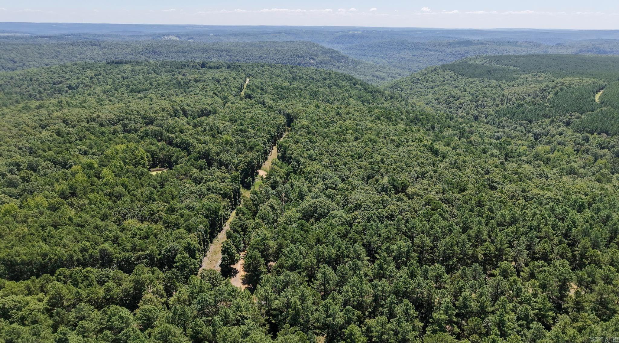 Come see this land in person. These two parcels (approx. 16.53 acres and 10 acres) can be sold together or separately and are ready for your vision! This property (10 +/- acres) has a entrance, power available, and West Stone County Water is available on the same side of the road. The land does not have a cleared building site yet, but with some clearing, you could open up the seasonal mountain views and create the perfect spot for a cabin, home, or campsite. There are also natural bluff formations and a trail already on the propertyāideal for exploring or enjoying the outdoors. There are no restrictions, so you can build, camp, homestead or just enjoy the space. Itās quiet, open, and full of potential. Whether youāre looking for a weekend spot, hunting land, or a place to build your dream homeāthis is worth walking. A power line easement runs through the property for easy access to electricity