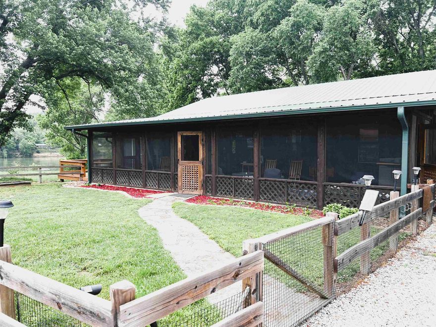 White River Living – Home + Shops on 2 Lots! Endless Potential Close to Town Welcome to 852 & 892 N. Riverview – a rare opportunity to own a cabin & multi-use shop buildings just steps from the White River & minutes from Mountain View. This 1,636 sq ft home features a screened-in front porch perfect for year-round enjoyment, fresh paint in the bedrooms, & a converted mudroom/utility room with restored laundry access. The cozy layout offers 2-bedrooms, 1-full bath, & a flex room ideal for extra seating or home office. A breakfast bar, kitchen/dining combo, & all major appliances are included. Outside, the possibilities are endless. Spanning over 2.4 acres, the main home's septic system is located on the adjacent lot, which also features a spacious 1,850 sq ft insulated shop w/electricity, an 18x40 metal building perfect for RV/boat storage, & a 14x18 outbuilding for additional workspace. A newly expanded workshop off the carport shed adds even more flexibility. Enjoy mountain views, river proximity, & privacy, whether you’re seeking a full-time residence, a family getaway, or an income-generating investment. Bring your fishing poles, kayaks, & imagination—this is river living!