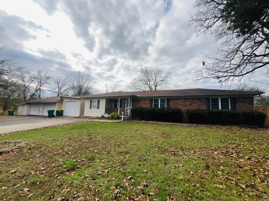 Charming home on +/-3.02 acres with a storage shed, that has electricity, an RV Carport with electric hookup, a detached workshop and garage. A small deck out back that overlooks the creek! The home features a bonus room that could be used as an extra bedroom or office space, a large den with several windows that allow lots of natural lighting and it has 2 exit doors, one that opens up into a new fenced in area.  This is a must see!  Schedule your showing today!