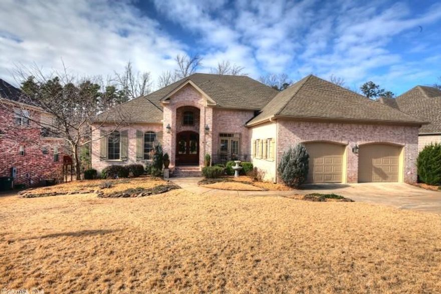 Stunning home with beautiful detailing. Master plus two bedrooms on the main level. Kitchen has a wonderful layout, and overlooks spacious Great room and breakfast area. Large master suite with luxurious spa bath.   Downstairs hosts bonus area, two additional bedrooms, full bath & wet bar. Surround sound. Professionally done upgrades include upper deck; extensive landscaping; shutters; & more. Covered area on lower level opens to slate patio w/firepit. Fabulous storage areas.  Backs to greenbelt.