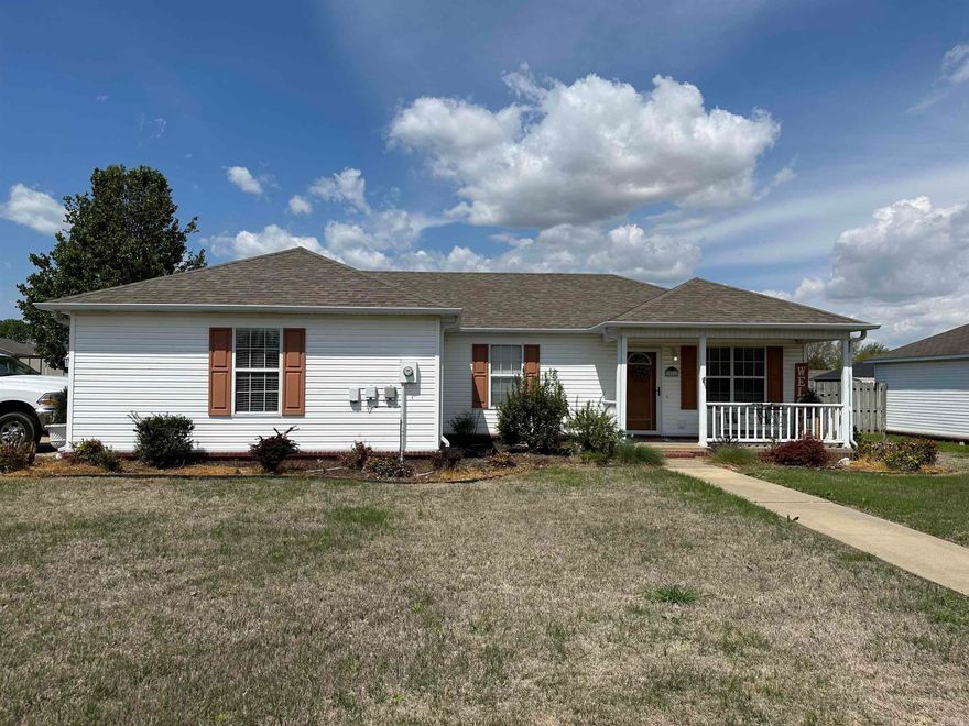 This house is on a corner lot with fenced in backyard and a 2-car garage.  The house has a great room for eating and entertaining. All three bedrooms and two baths with a laundry closet in the hall are located on the west end of the home.  The interior has been recently painted and new floor throughout the house.  This is a must see for anyone looking for a place to call home.   "See agent comments."