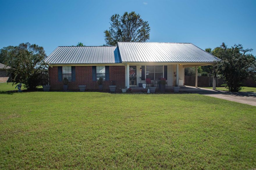 This sweet home has so many updated features.  New flooring in 2021.  Stunning new granite counter tops in bathrooms and kitchen updated in 2021 as well.  A striking new metal roof installed in 2023 sets the house apart.  New HVAC unit installed the last week of August 2025.  The spacious back yard features shop offers two separate "his and hers' areas, perfect for storage, hobbies, or a workshop.  Complete with A/C and even a front porch.  With generous storage throughout and plenty of potential to make it your own, this home is a must-see.  Call today!  This won't last long.