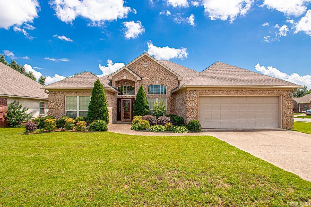 Introducing 2984 Hazelwood Drive, Benton, AR 72015. In the highly sought after neighborhood of Heritage Farms, this corner lot home radiates with curb appeal with fancy brickwork and detailed flowerbeds, you are not going to want to miss this one! This beautiful open floor plan features 2193 sq. ft., 4 nice sized bedrooms, 2 full baths with double sinks, a formal dining room open to the living room with a gas fireplace and an eat-in kitchen including granite countertops, stainless steel appliances and a walk-in pantry. There's lots of extra space in the walk-in laundry room! The large master bedroom has plenty of room to make a luxurious retreat featuring a jetted tub and walk-in shower, double sinks, separate potty room and nice walk in closet with storage galore. One of my favorite parts of this house is the large covered back patio perfect for a fun outdoor space for porch sitting, cookouts and to watch the kids play in the nicely fenced backyard. This property is a standout because it's one of the only neighborhoods in the Bryant School District that has a neighborhood zero entry pool, pavilion and playground! This home is ready to welcome its new family!