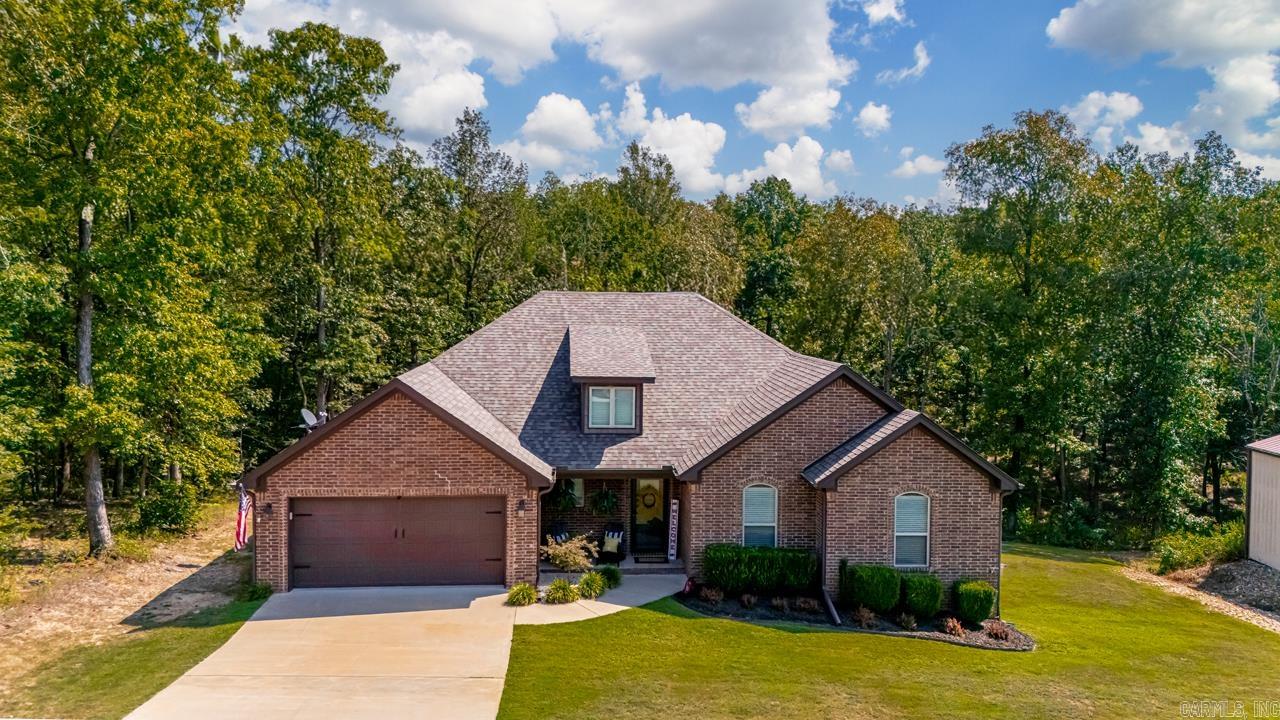 Awesome 4 Bedroom Home sitting on almost 3 acres Custom Touches, Large windows, Vaulted Ceiling, built ins, Hand Scraped hardwoods, with an extended porch to watch the deer frolic in the backyard. This home also boasts a 30x40 Shop that not only has electricity but is heated and cooled as well. This piece of heaven awaits make your appointment soon!