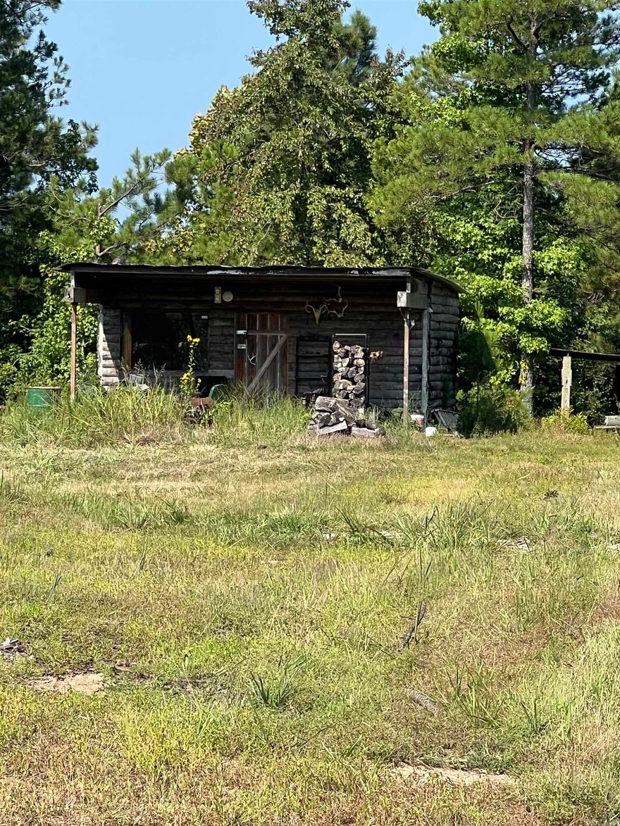This is a rare find for serious hunters or those just looking to escape into nature. Your private hunting cabin 12 acres+/- is all set up and waiting-just for your next adventure. Just bring your gear, and wake up each morning to a breathtaking view just outside your window. This off- grid camp offers the perfect balance of seclusion and comfort. It features solar lighting and hookup for your generator.