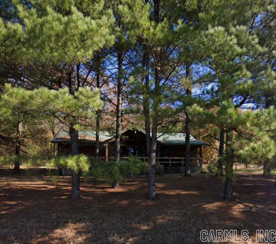 This home is ready for its new owner. This rustic charming wood and rock house has a large inviting porch that is the length of the house, a spacious open floor plan with vaulted ceilings. The large master bedroom with a nice walk in closet and double vanities in the oversized master bathroom. The kitchen has lots of cabinet space and the oversized laundry room has plenty of storage space.